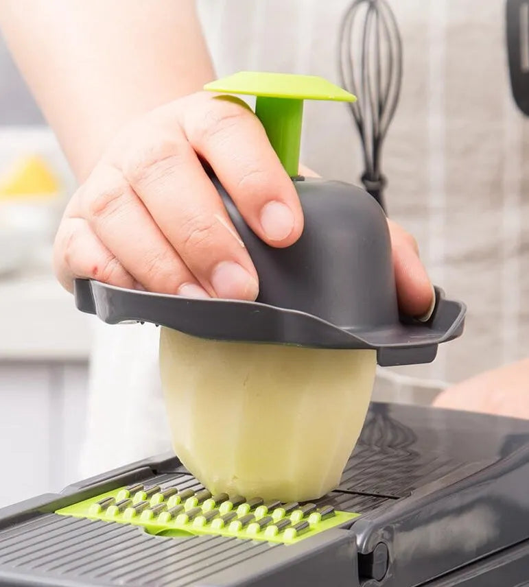 Multifunctional vegetable cutter with seven stainless steel blades on a kitchen counter