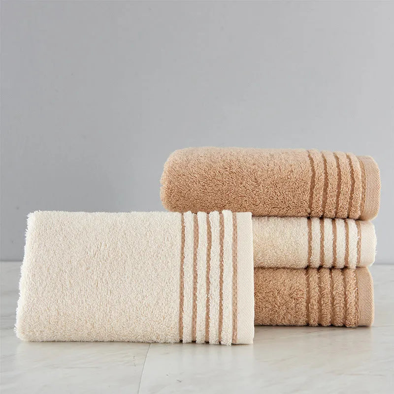 Cotton towel set showing three sizes in beige and brown colours for bathroom use