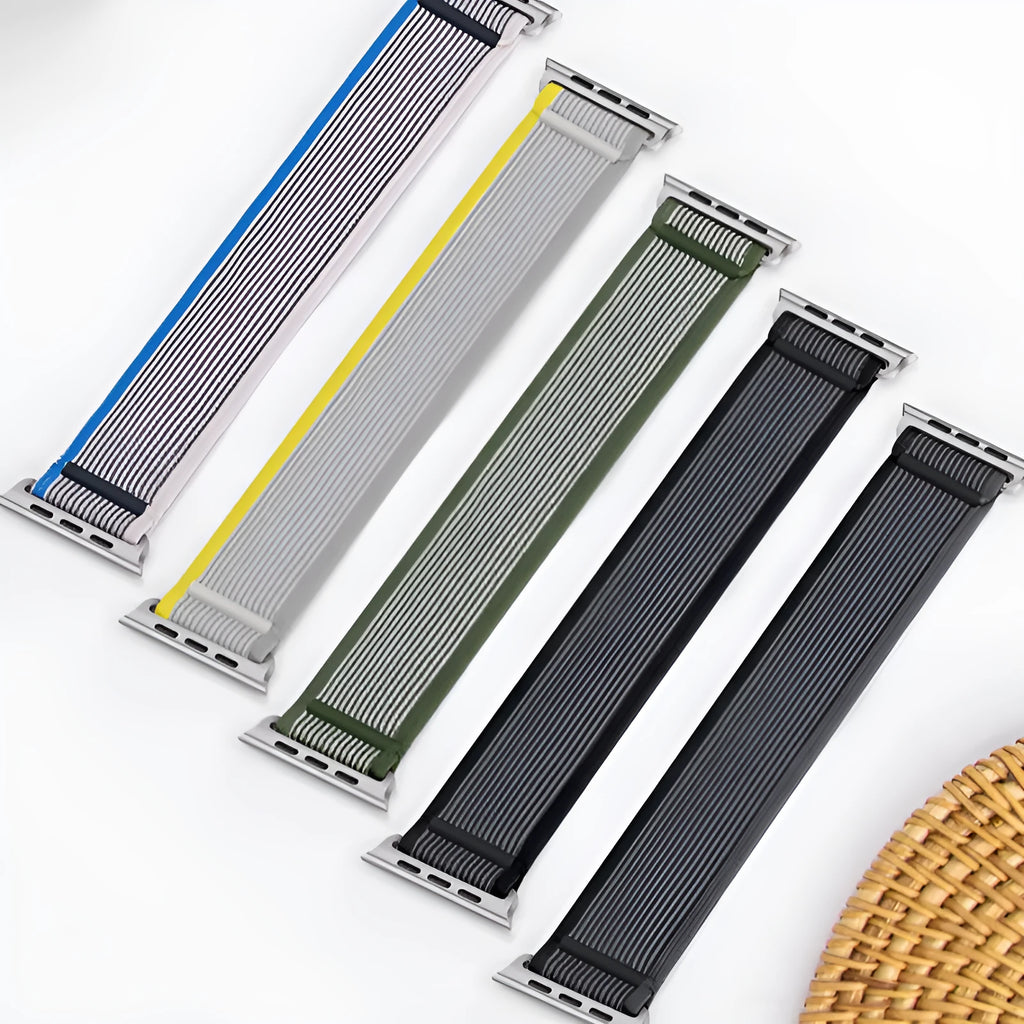 Nylon single ring strap Apple Watch band in multiple colours on a grey background.