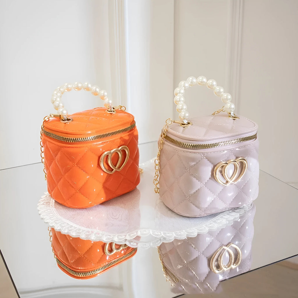PVC bucket-shaped gel bag for women with a heart pattern, shown in apricot colour.
