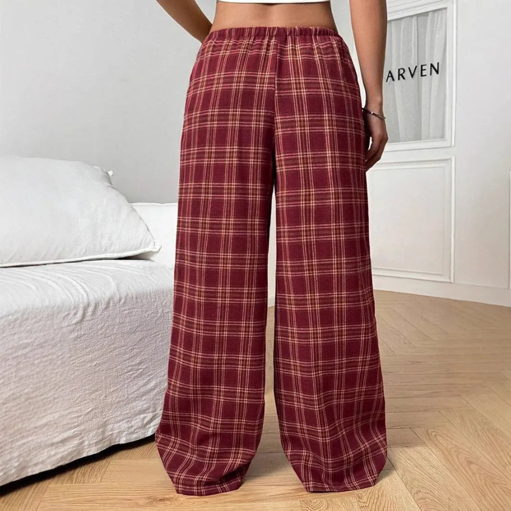 Blue plaid women's casual trousers with drawstring waist and pockets on a hanger.