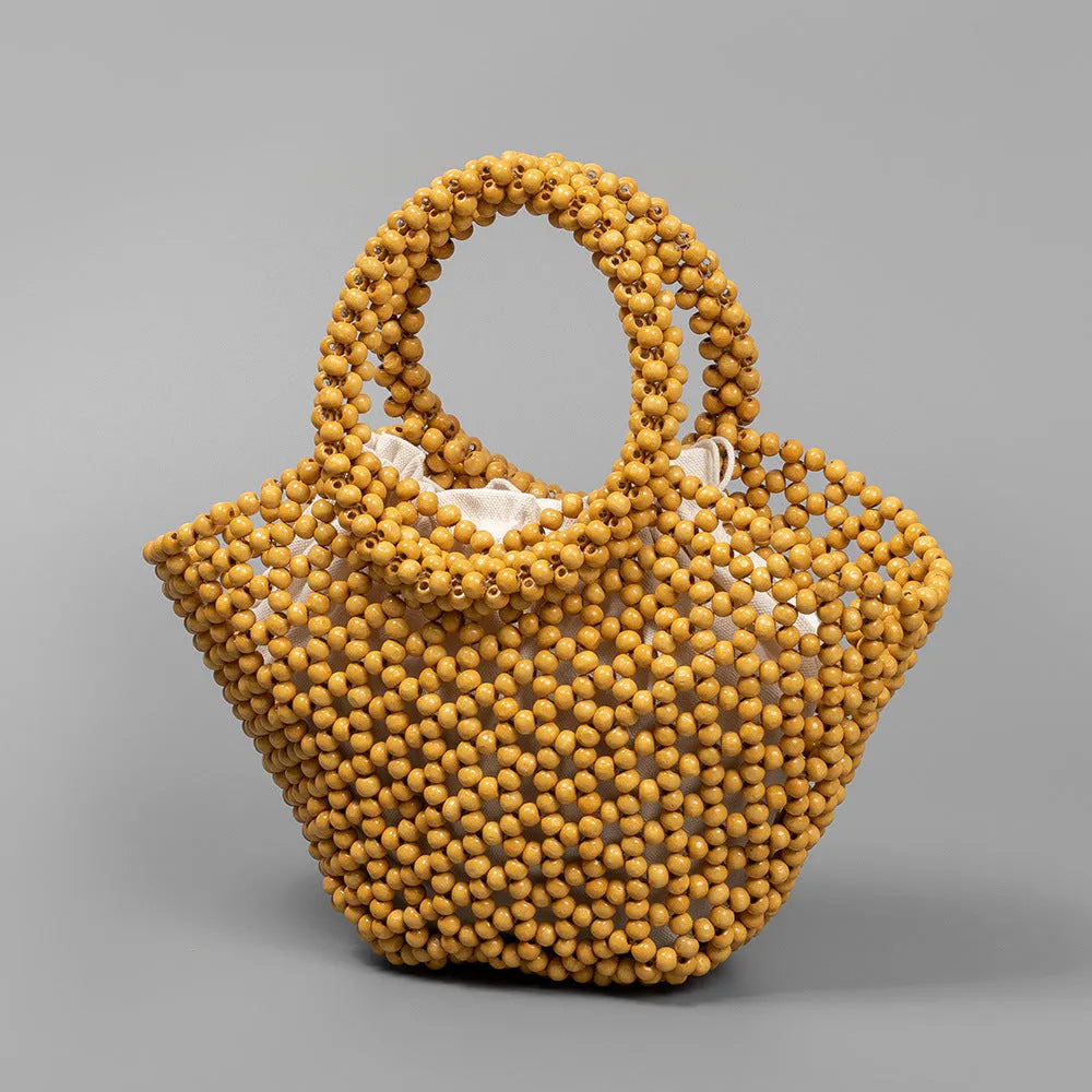 Maple wood hand-woven seaside handbag with wooden beads in dumpling shape