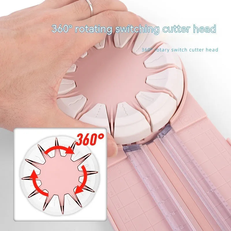 Pink plastic 12-in-1 multifunctional paper cutting machine for crafts on a white background.