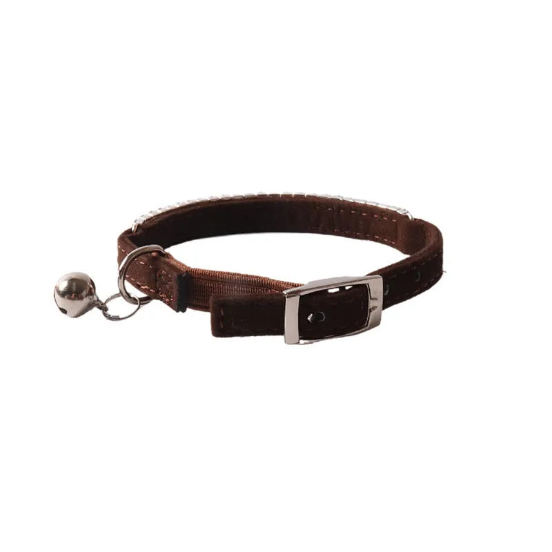 Colourful flannel-pattern cat collar with elastic buckle on a white background.