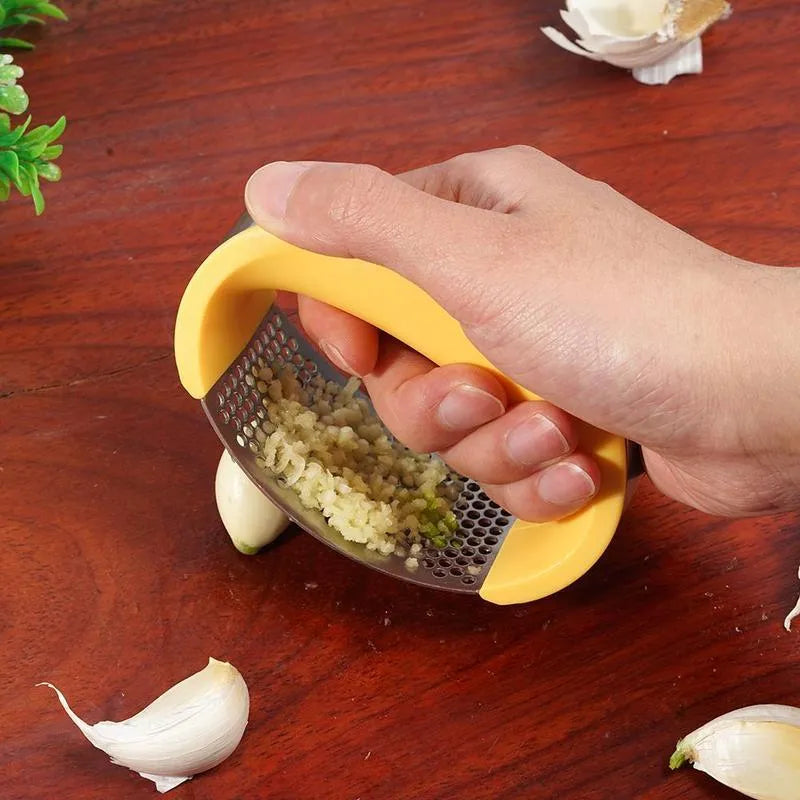 Stainless steel garlic press with ergonomic handle in available colours for kitchen use