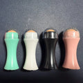 Volcanic stone portable roller for oily skin control in black, green, pink, or white.