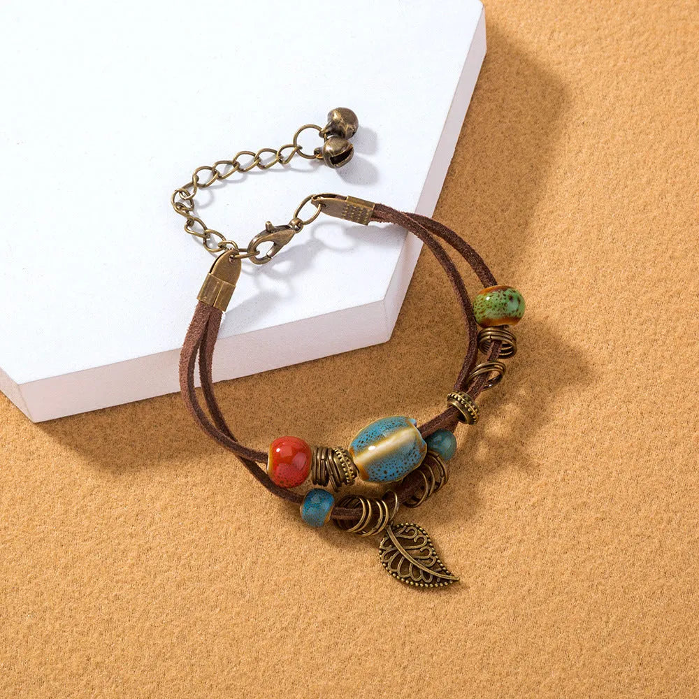 Hand-woven cowhide rope bracelet with blue ceramic beads geometric splicing style