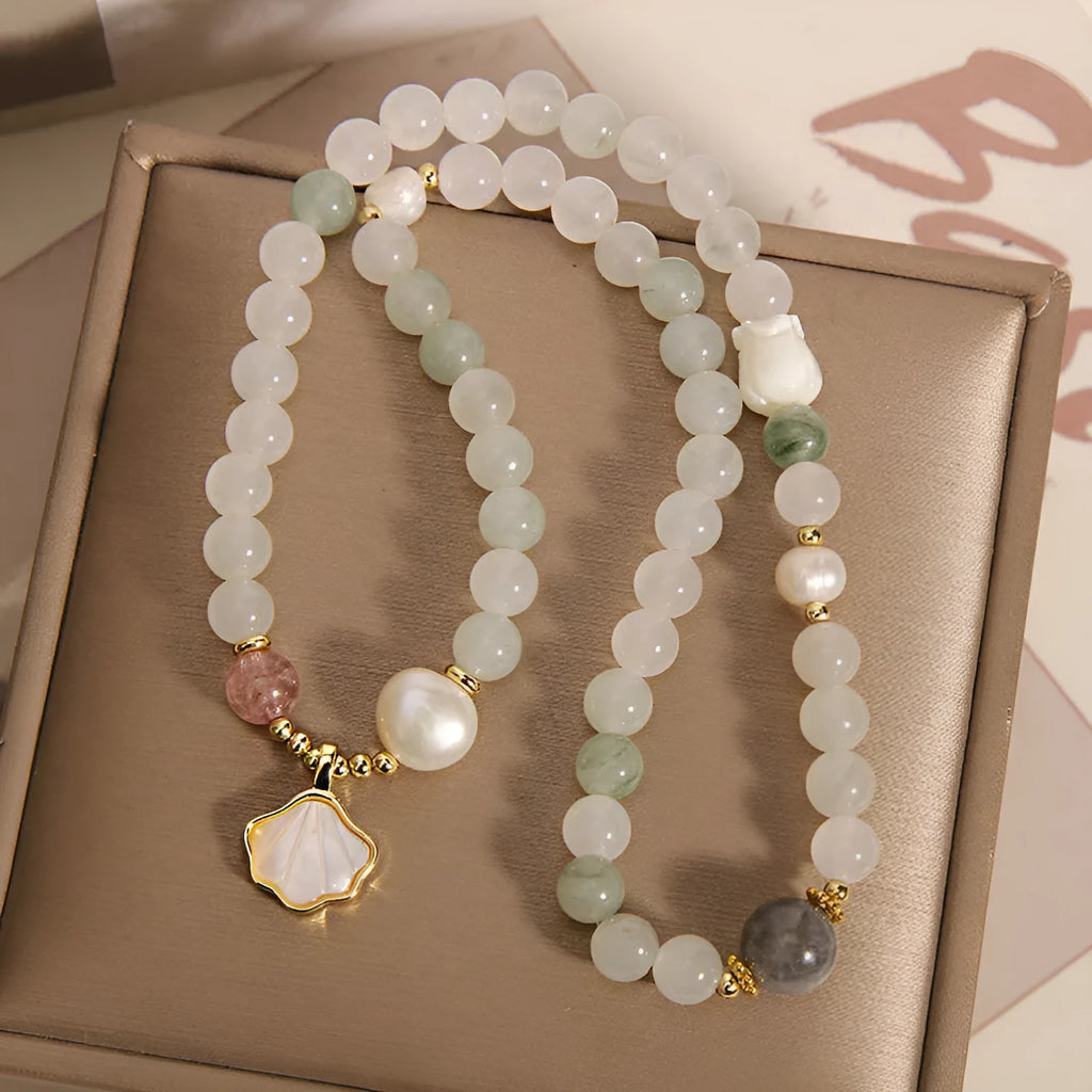 Tianshan Emerald Green Crystal Bracelet with apricot leaf pendant and gold-plated gemstone details
