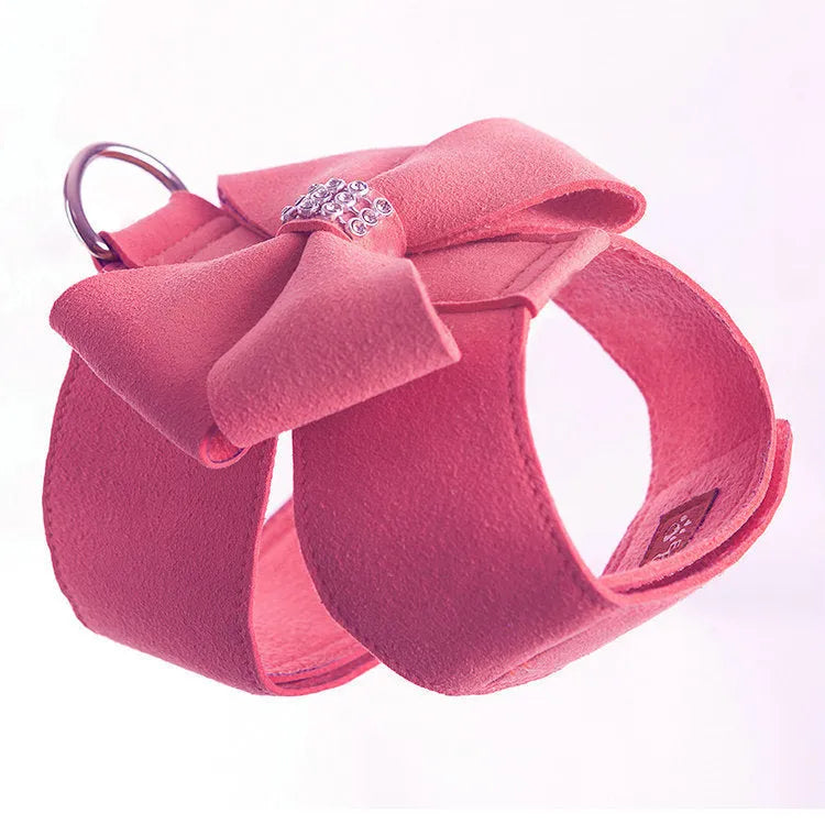 A pink microfiber puppy chest strap with a bowknot, shown alongside blue and orange options.