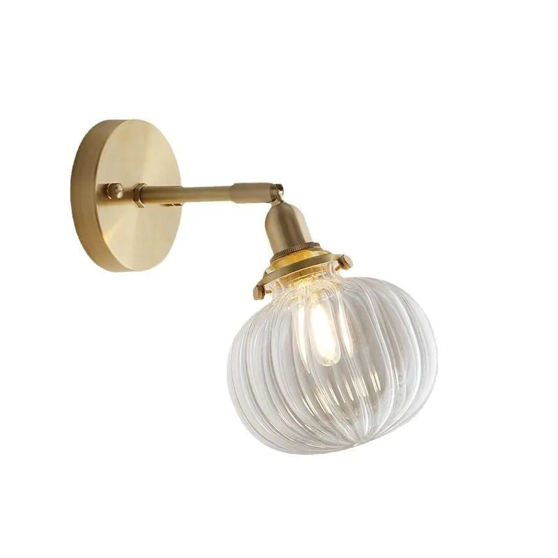 Creative pumpkin-shaped glass wall lamp in blue and transparent glass finishes for living room or bedroom.