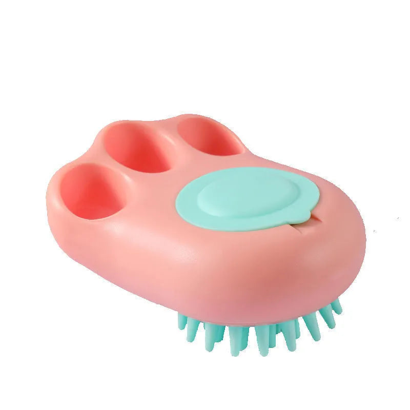 Blue silicone claw-shaped pet bath brush with flexible bristles for washing cats and dogs.