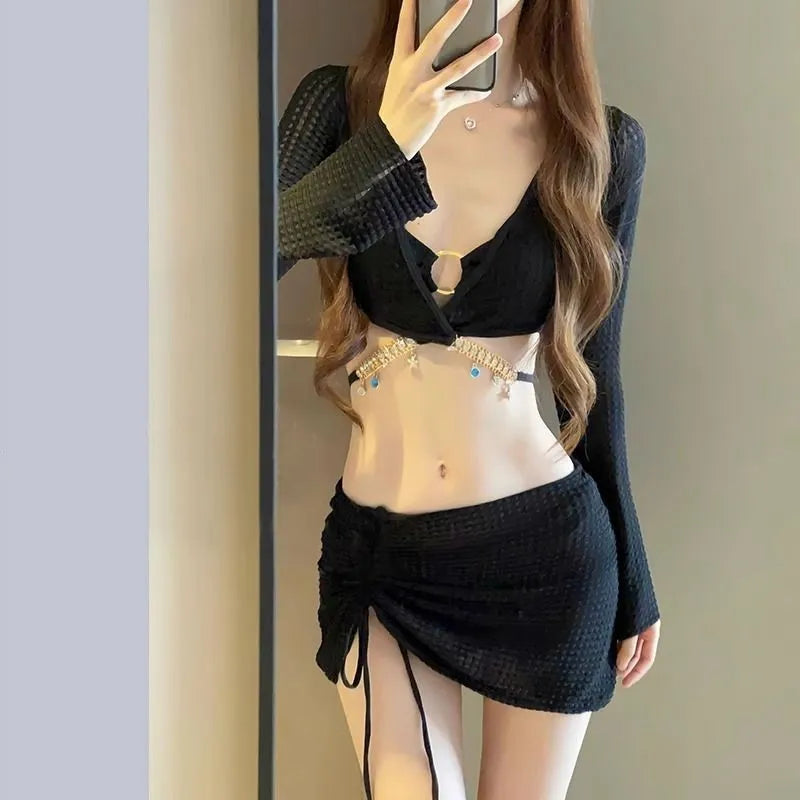 Women's long sleeve bikini swimsuit set in black or white polyester for swimming