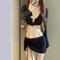 Women's long sleeve bikini swimsuit set in black or white polyester for swimming