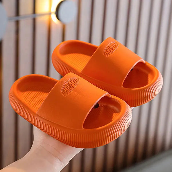 Children's colourful EVA slippers with a textured non-slip sole, shown in a mixed colour selection.