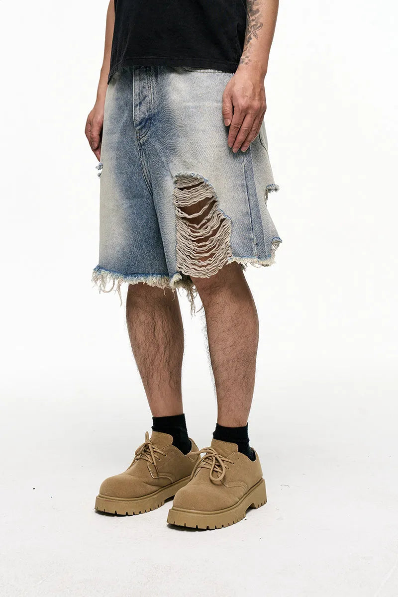 Men's light blue retro washed baggy denim shorts on a hanger