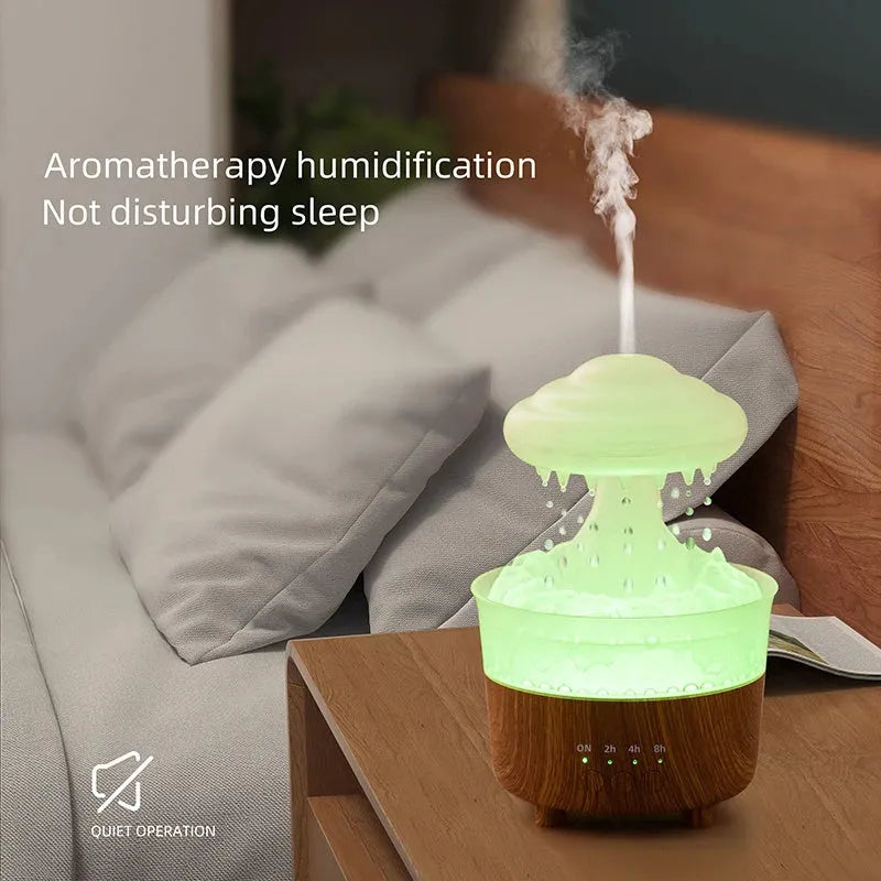 Wood grain white rain cloud-shaped ultrasonic humidifier diffuser with LED lights on a table.