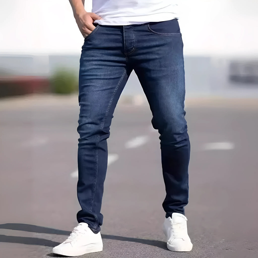 Men's dark blue skinny-fit casual jeans with a zip fly on a mid-waist.