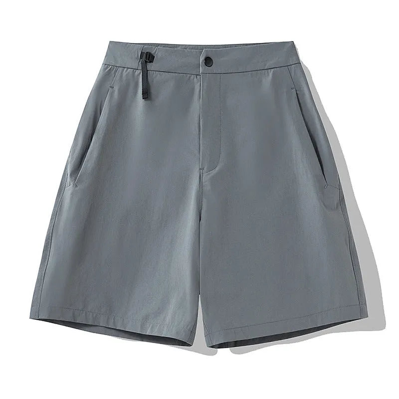 Men's quick-drying sports shorts in khaki colour with a four-sided elastic waistband, shown flat.