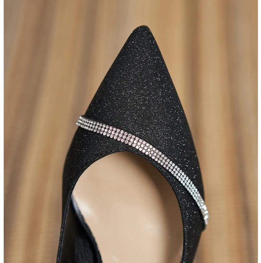 Black sequined women's high heel pumps with a 7cm stiletto heel and low upper.