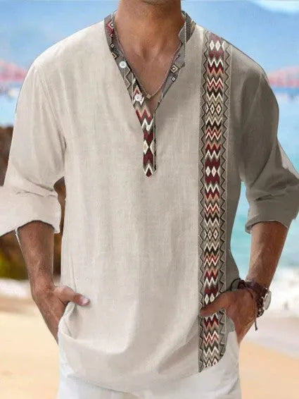 Man wearing a thin, striped casual Hawaiian long sleeve shirt in a linen-look fabric.