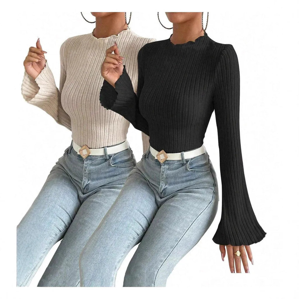 Slim-fit long-sleeve top in black with sunken stripe texture and lantern sleeves on a hanger.