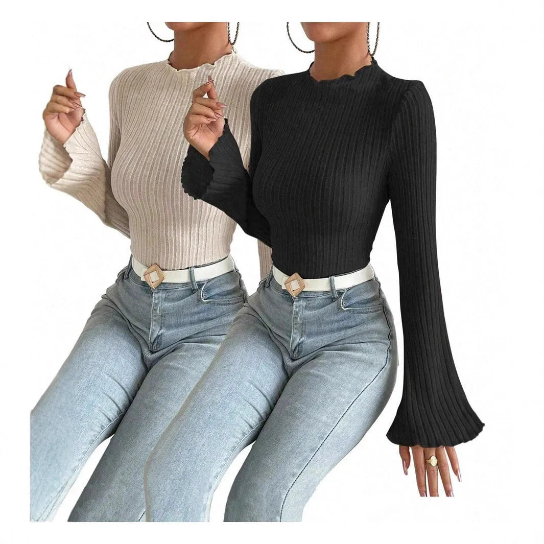 Slim-fit long-sleeve top in black with sunken stripe texture and lantern sleeves on a hanger.