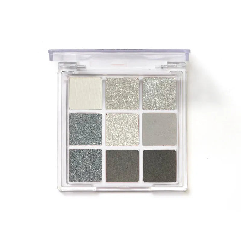 Smoked nine-colour eye shadow palette showing white, silver, black, and iron grey shades.