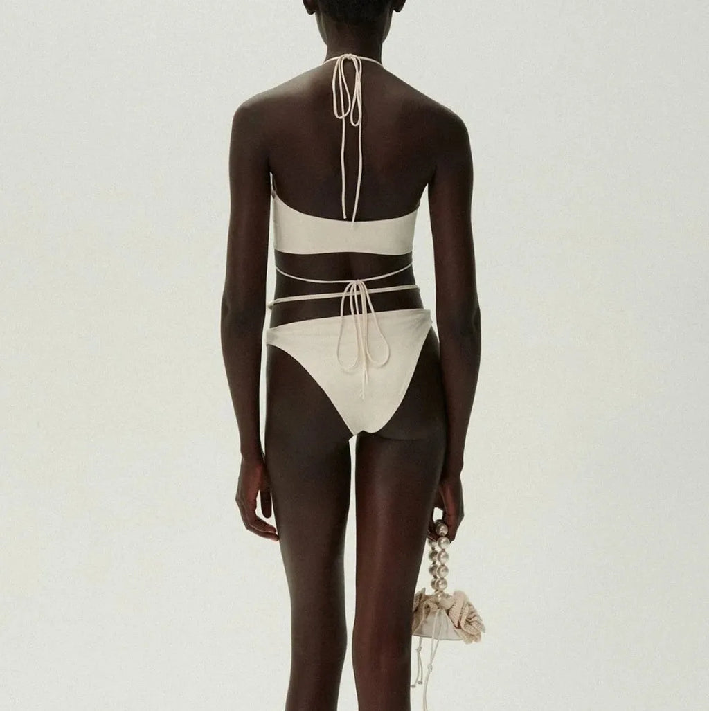 Women's black split bikini swimsuit with lace-up detailing and briefs style design