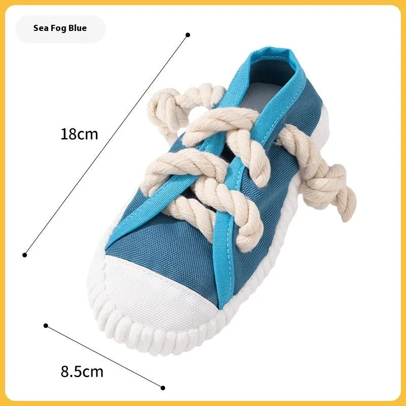 Plastic squeaky slipper-shaped dog chew toy in yellow, black, or blue.