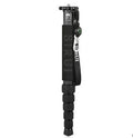 Black carbon fibre telescopic camera monopod fully extended next to a DSLR.