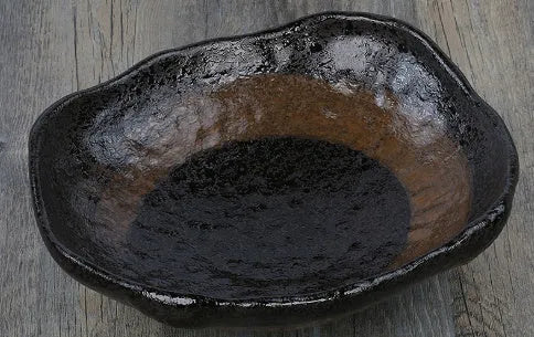 Japanese style irregular shaped ceramic sashimi bowl with floral decoration and sauce dish