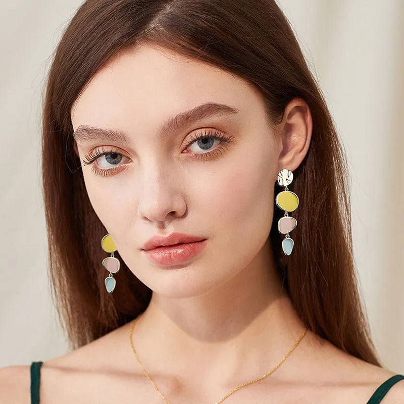Morandi three-colour dripping oil finish alloy disc earrings on a sterling silver post.