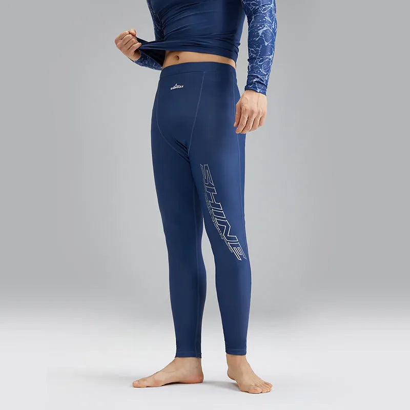 Men's dark blue nylon swimwear set with pattern detail showing swim top and trunks