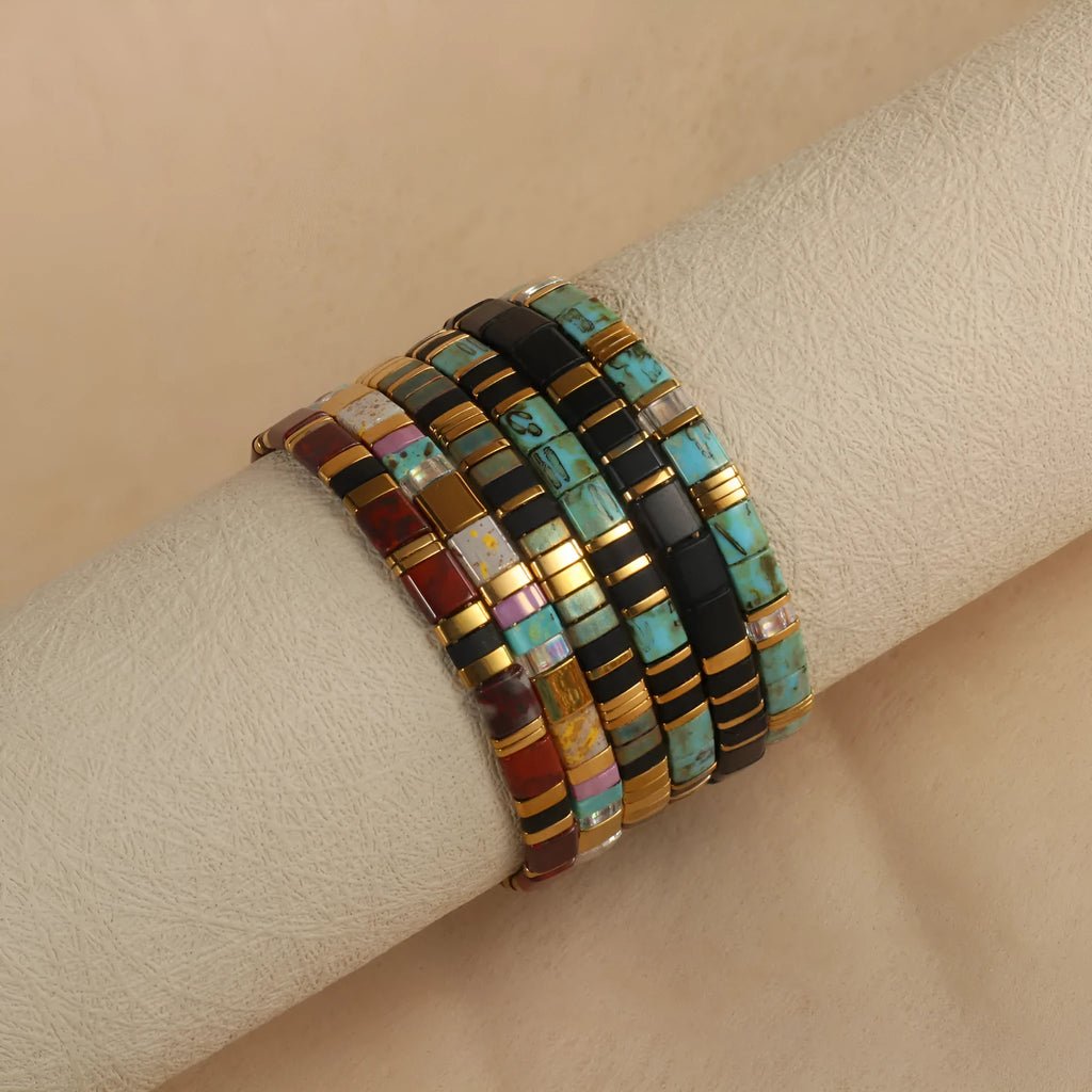 Geometric pull bead bracelet with glass and coloured glaze beads in round design