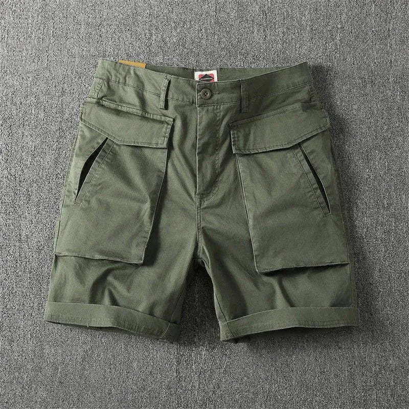 Men's straight-leg cotton cargo shorts with stretch in multiple colour options on a size chart.