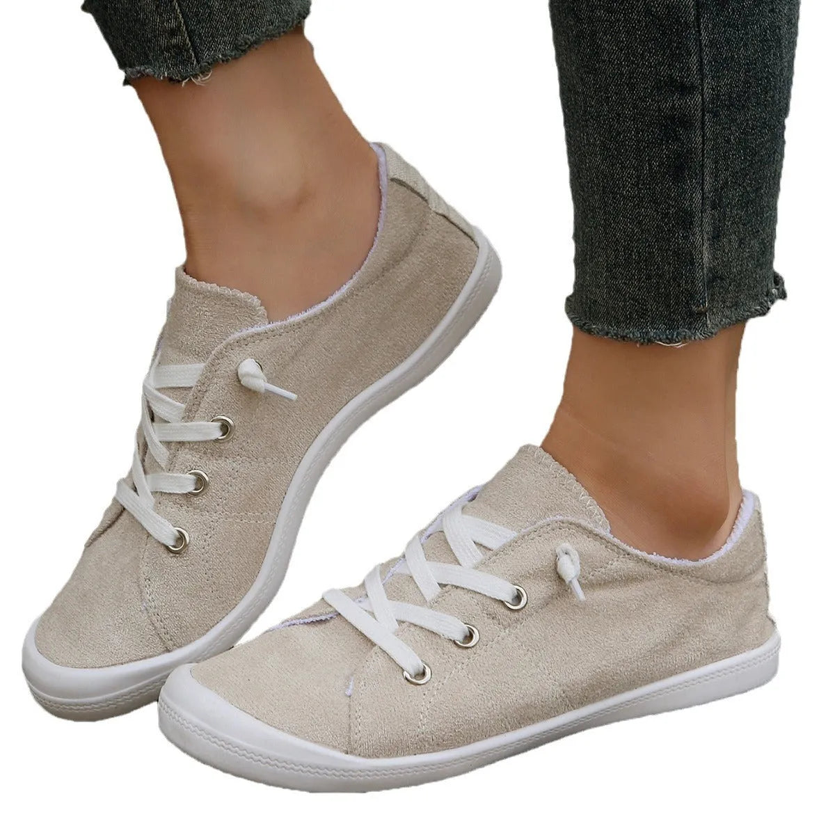 Women's creamy white fabric casual sneakers with low-top design and rubber sole