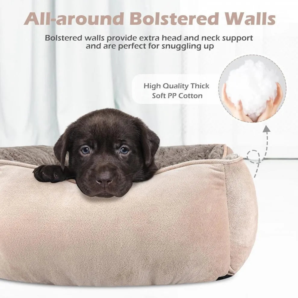 Beige bolster dog bed for large dogs with soft interior and raised sides on a wooden floor.