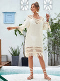 Apricot coloured hand-crocheted women's long beach dress with a lining, shown on a model.