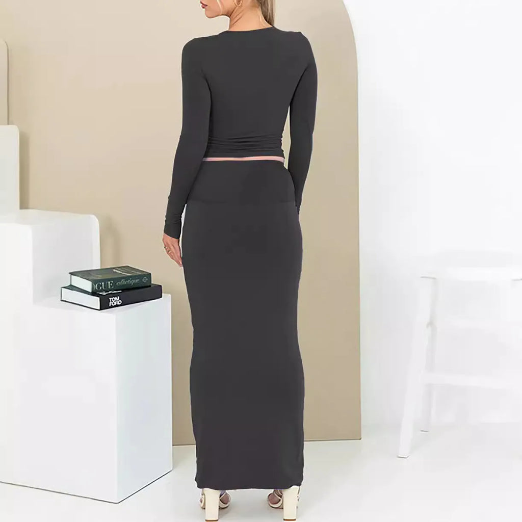 Women's sweet style polyester two-piece suit with three-quarter sleeve top and long skirt.