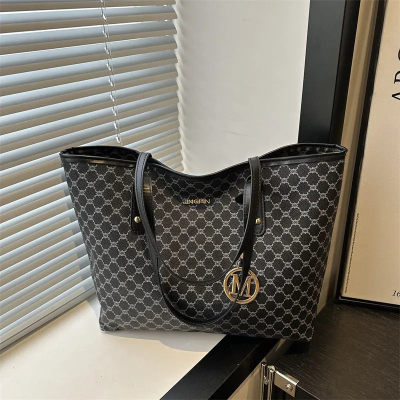 Women's western style PU leather shoulder bag in black showing visible sewing thread details.