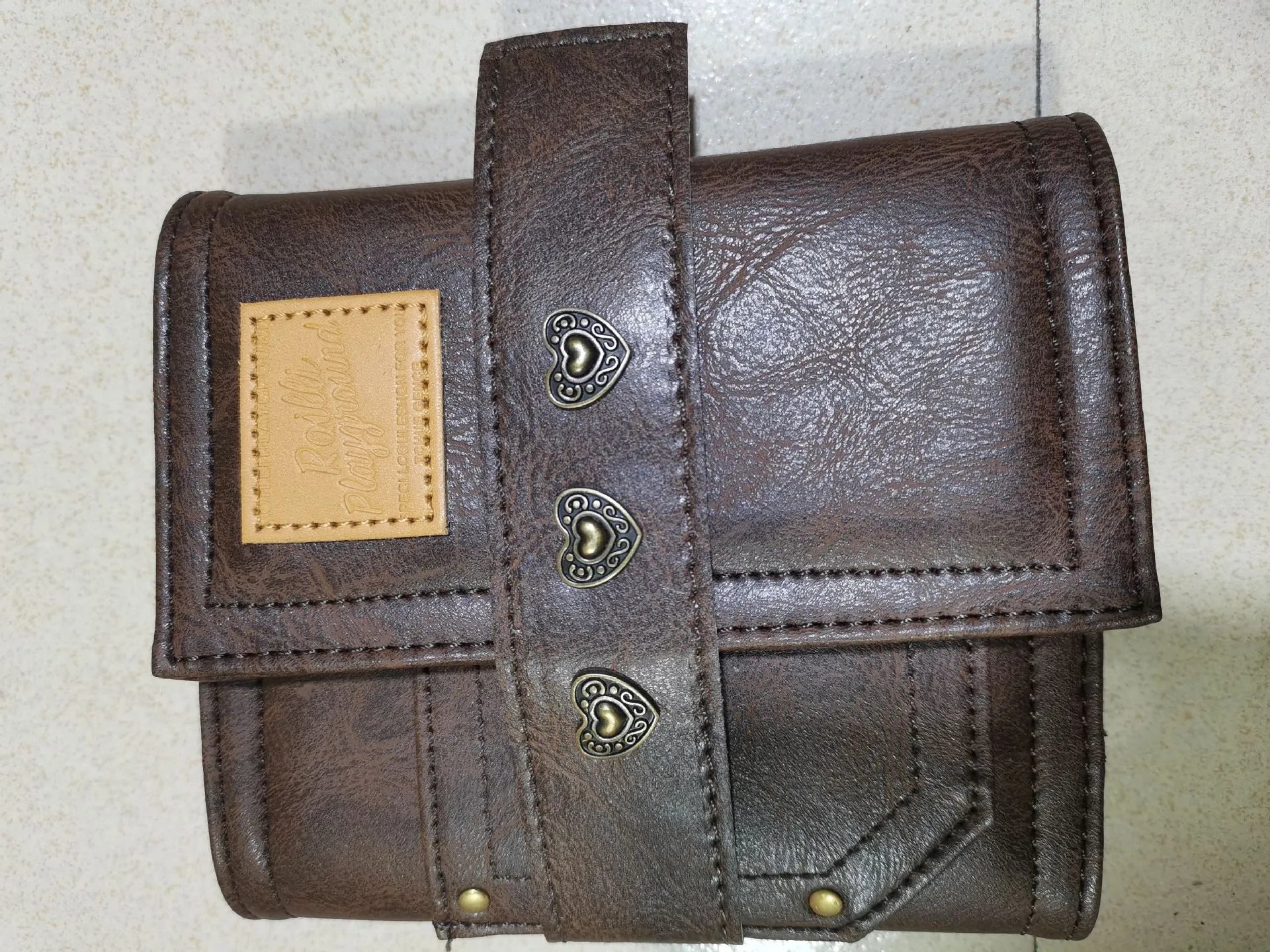 Creative retro brown A7 notebook with leather-style buckle and loose-leaf binding