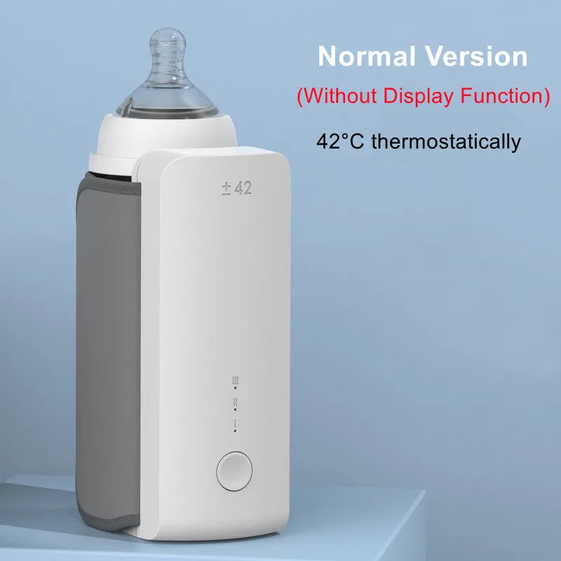 Grey portable USB rechargeable baby bottle warmer with digital display wrapped around a baby bottle.