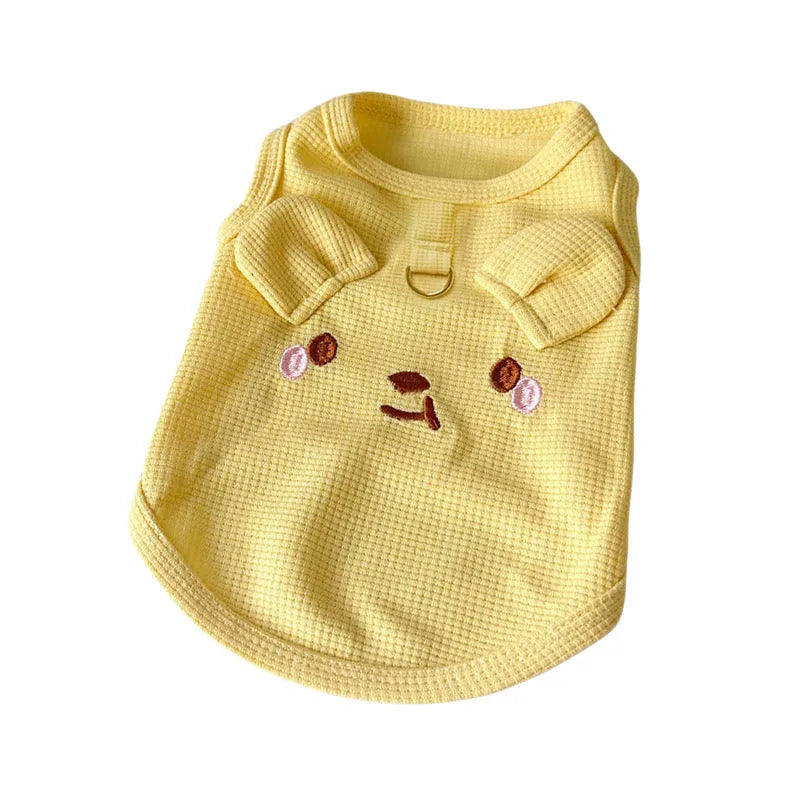 Yellow waffle-textured dog vest on a mannequin, showing casual fit and lightweight fabric.