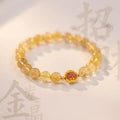 Gold rutilated quartz crystal bracelet with diamond-cut beads in 6mm and 8mm size options.