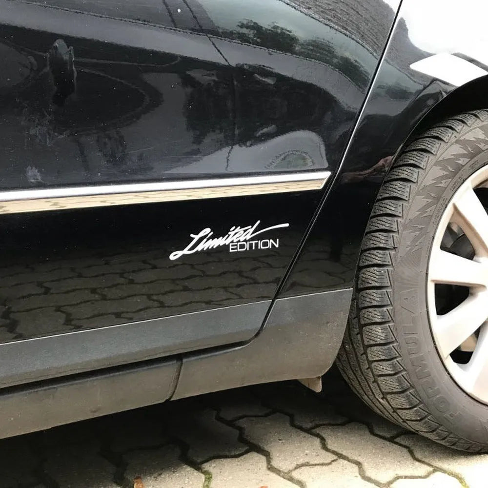 Reflective plastic bumper sticker in black, white, and colourful options showing 16cm by 3.8cm size.