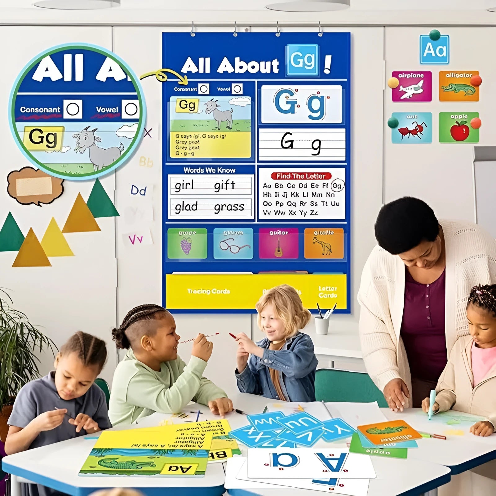 Large fabric alphabet learning chart with sets of educational word cards, letter cards, and picture cards arranged around it.