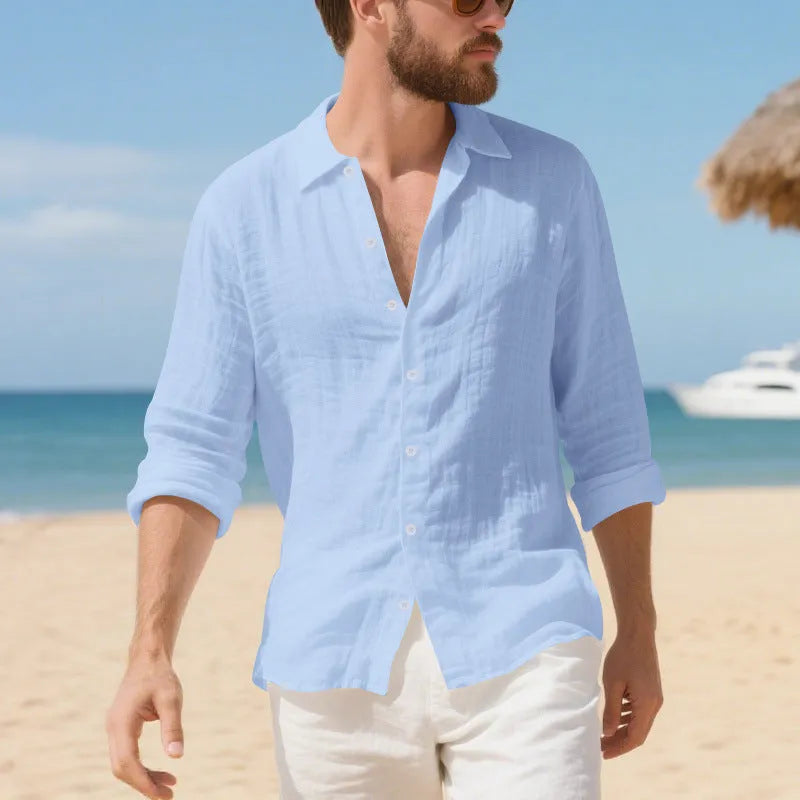 Man wearing a loose-fit light blue linen casual shirt with short sleeves