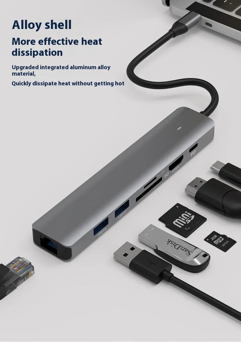 7-in-1 USB-C multi-port hub with SD card slot, microSD slot, three USB ports, and PD charging port.