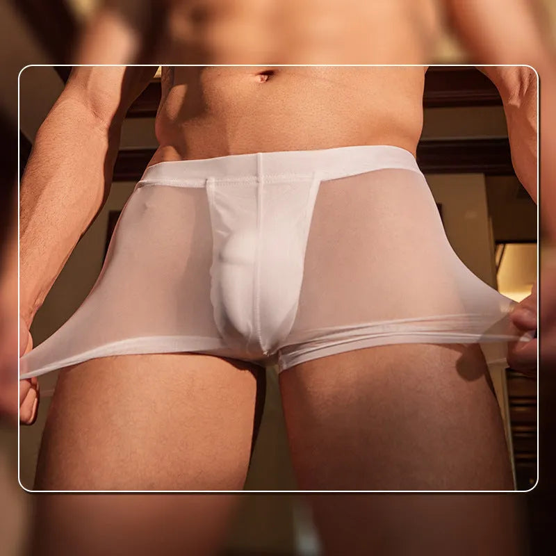 Pair of men's ultra-thin black nylon boxer briefs on a plain background.