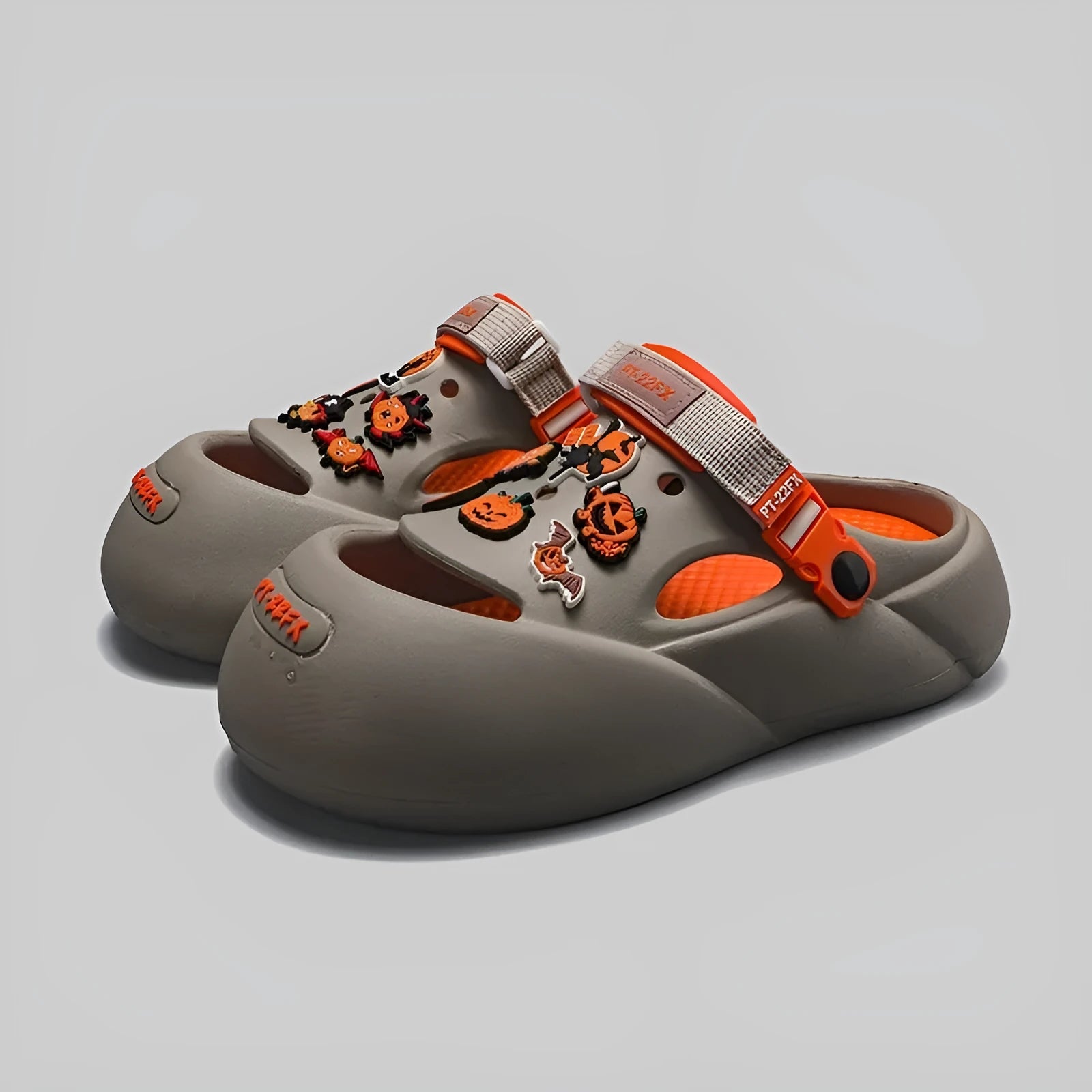 Men's grey EVA sole beach hole shoes on a sandy background